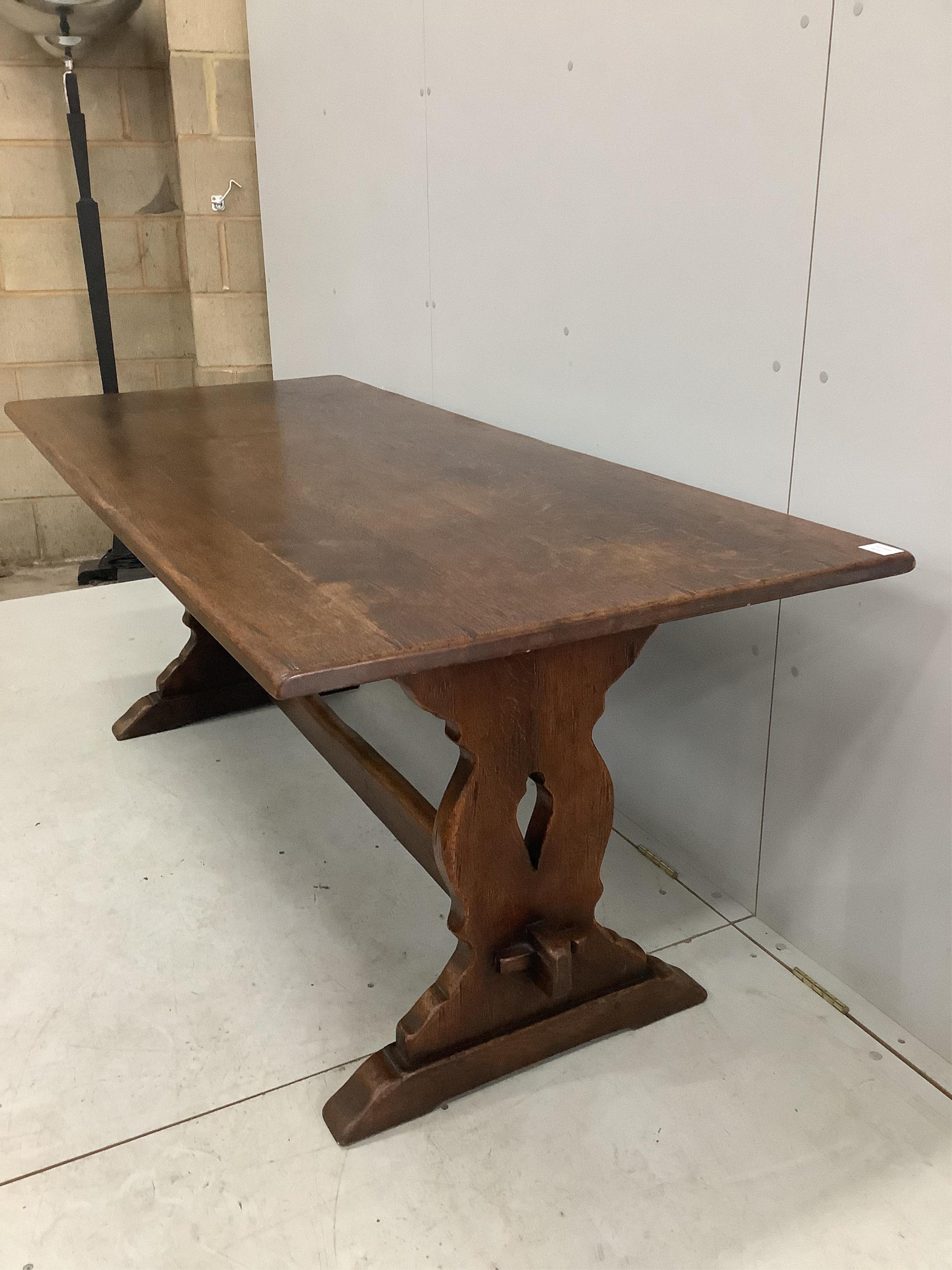 A set of six 18th century style oak ladder back dining chairs with rush seats, height of carvers 124cm, width of carvers 54cm and a 17th century style oak refectory table, width 183cm wide, depth, height 73cm. Condition